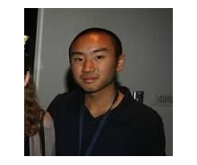 A man with a black shirt and a blue lanyard