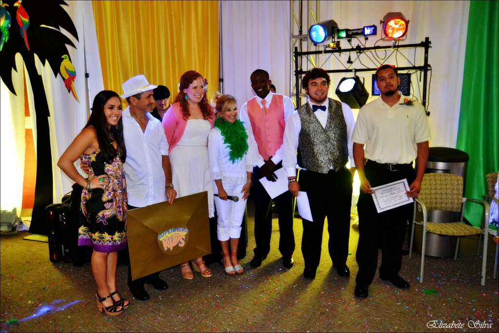 A group of people standing in front of a camera.