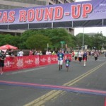 A group of people running in the texas round-up.