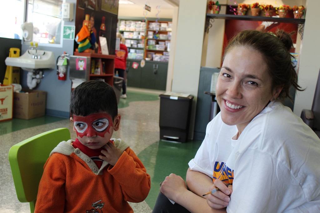 A woman and a boy with face paint