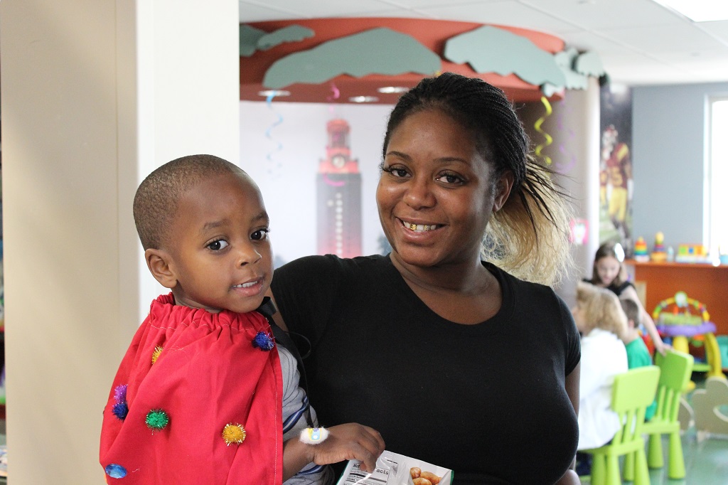 A woman holding a child in her arms.